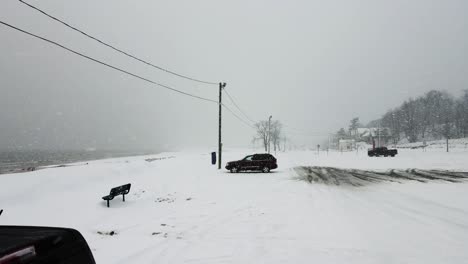 a storm rolling in over lake michigan with heavy snow