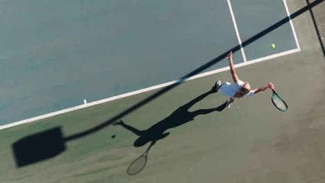 Video-of-top-view-of-caucasian-female-tennis-player-on-court