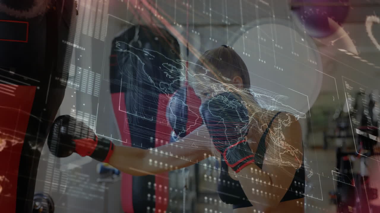 Female athlete punching heavy bag wearing boxing gloves, showcasing fitness with floating data grid