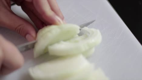 slicing onion in slow motion