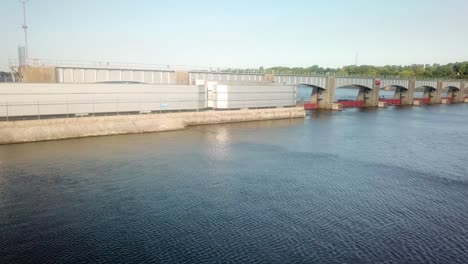 Drone-view-of-the-dike-and-moveable-portion-of-the-dam-of-Lock-and-Dam-14-on-the-Mississippi-River-consisting-of-13-tainter-gates-and-4-roller-gates-on-the-Resister-of-Historic-Sites