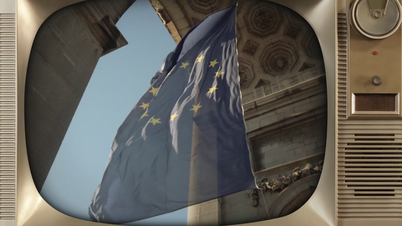 EU flag waving under Cinquantenaire Arch in Brussels displayed on retro style TV monitor