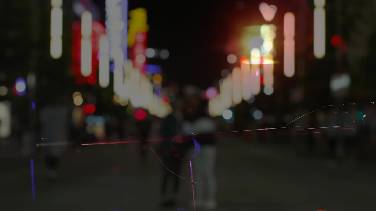 Crossfading revealing seated female music busker playing guitar for passersby blending neon lights