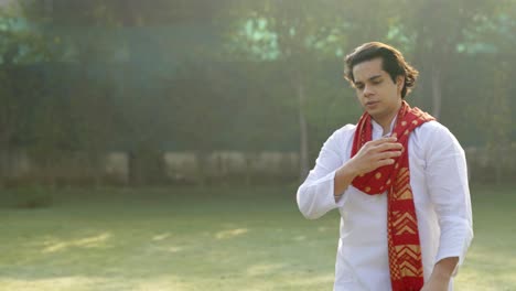 Confident-Indian-man-walking-in-an-ethnic-traditional-outfit