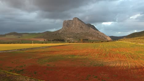 flying over the mountain called peña de los enamorados over green fields