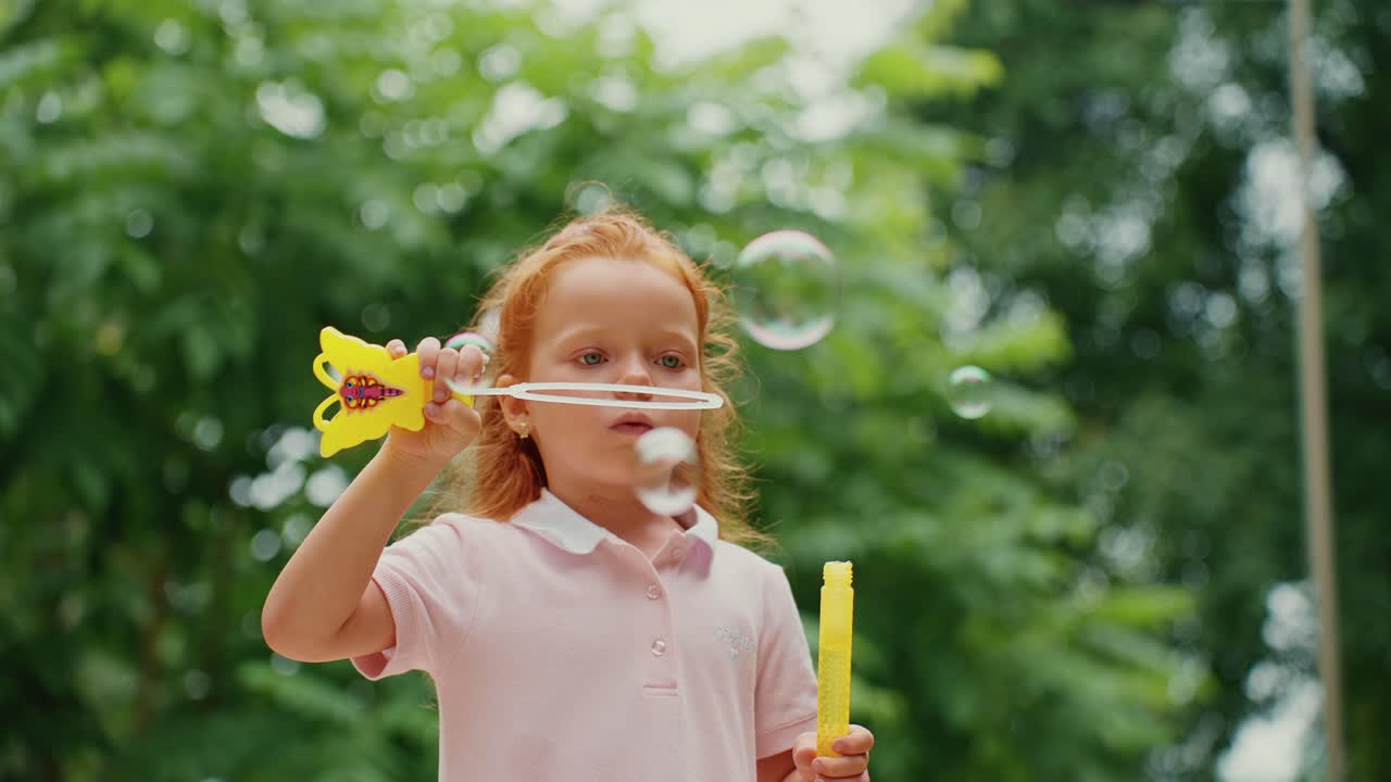 Girl Blowing Bubbles Outdoors