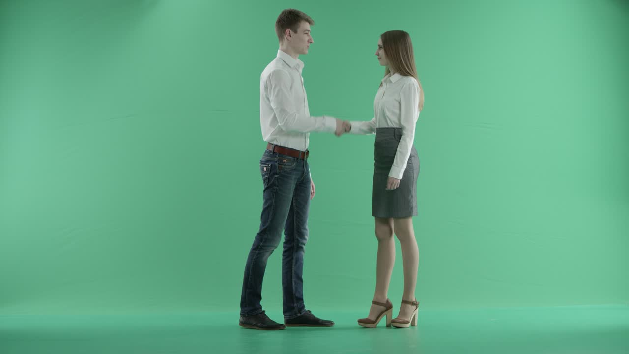 handshake between two businessmen on a green screen
