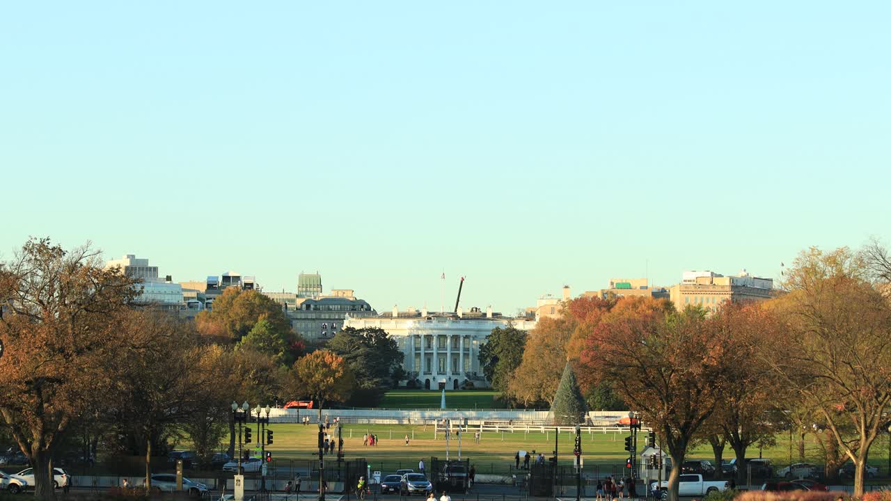 Road car traffic and tourists at White House Washington district, USA. Static