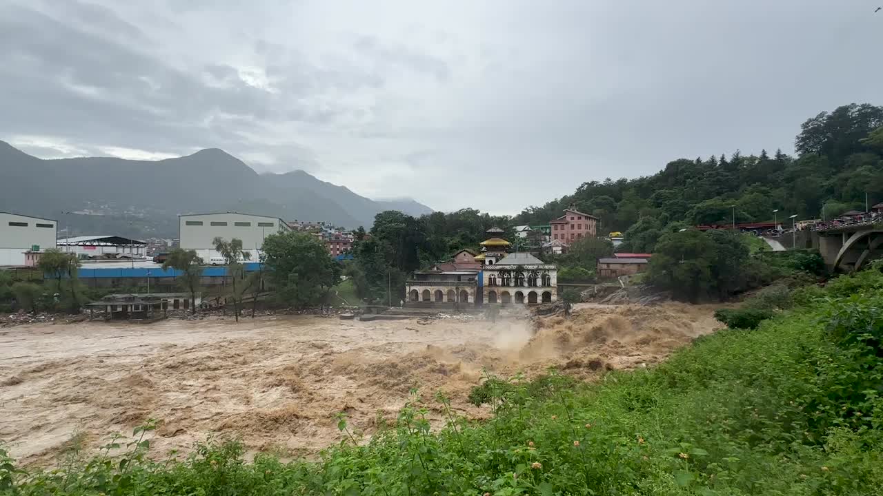 The flooding of the Bagmati River damaged the road and riverbank during heavy rainfall in Kathmandu, Nepal.