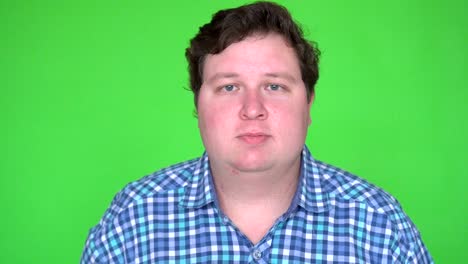 yes, fat man accepting offer agree against green screen.