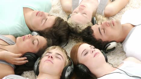 group of teenagers listening to music