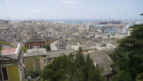 Sky-to-cityscape-of-Genoa-fast-tilting-down-shot