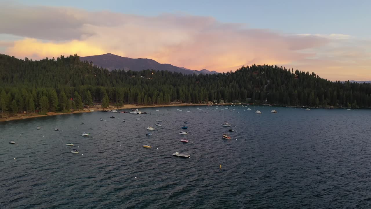 Boats At Lake Tahoe During Sunset In California, USA - aerial drone shot