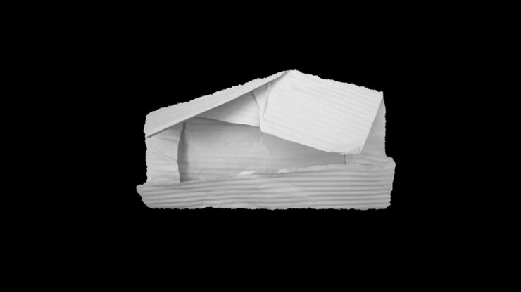 Crumpled white paper on black background