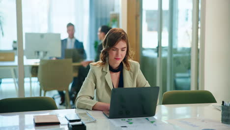 businesswoman working on laptop in office