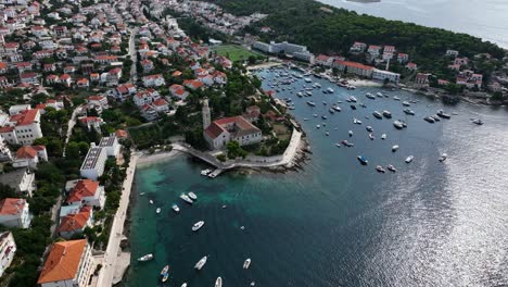 boats in hvar city bay in the dalmatian coast - aerial high angle