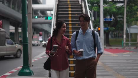 couple walking on city stairs
