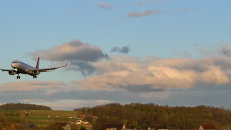 airliner aircraft in final approach for landing on runway. zürich, switzerland.