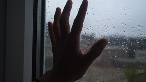 the hand of a depressed man, suffering from a burn-out