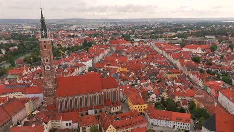 Soar above Landshut during sunset, where the golden hues illuminate the city’s skyline and create a magical atmosphere.