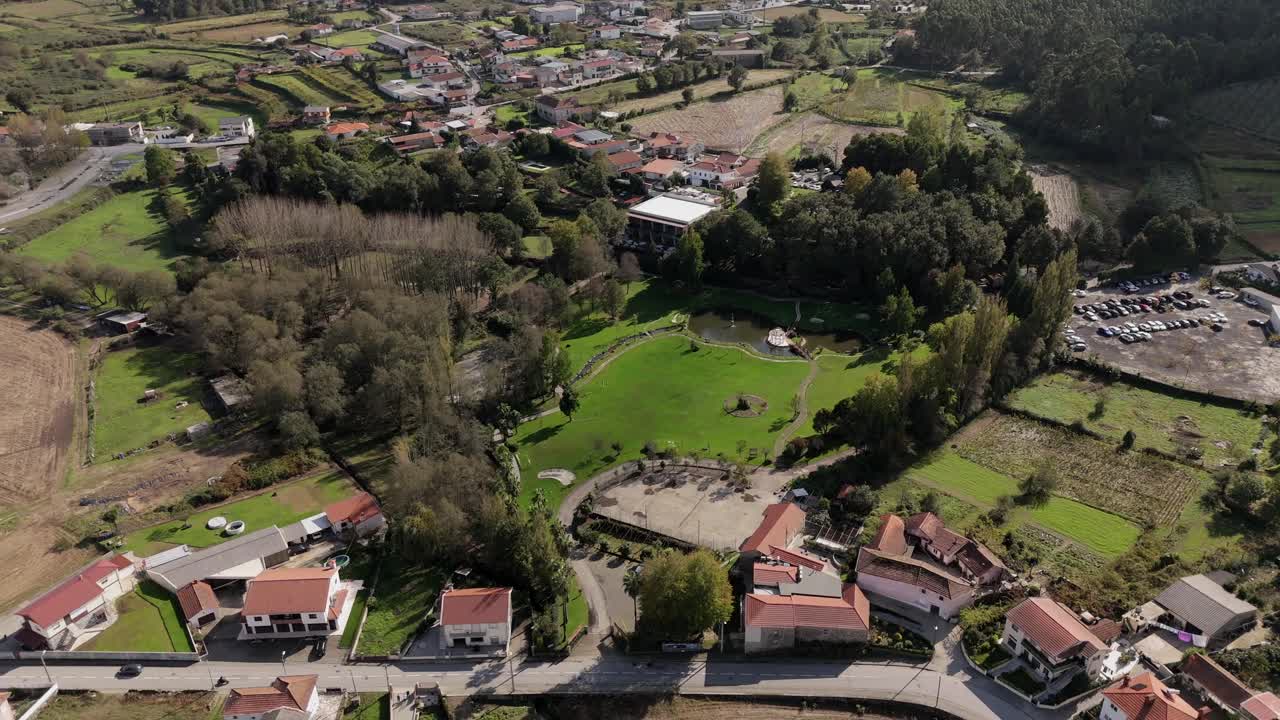Aerial landscape showcasing lush fields, trees, and buildings in northern Portugal