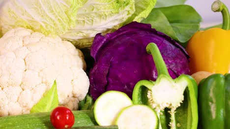 assorted vegetables displayed on a white background