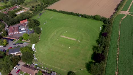 4k wide angle shot of a village cricket match in kent uk