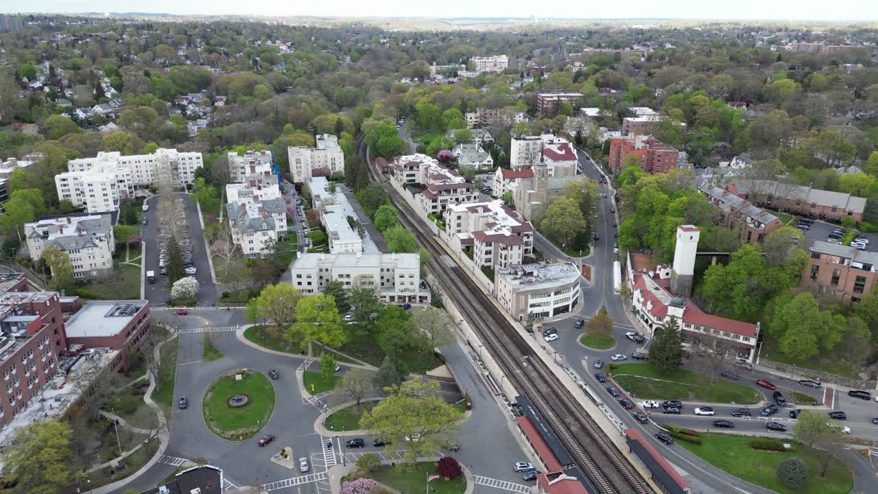 Drone side-tracking shot of Bronxville’s railway in horizontal orientation, capturing a dynamic aerial perspective of train tracks and transportation infrastructure.