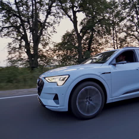 presentation of a white audi e-tron, compact luxury crossover suv. modern new cars for sale