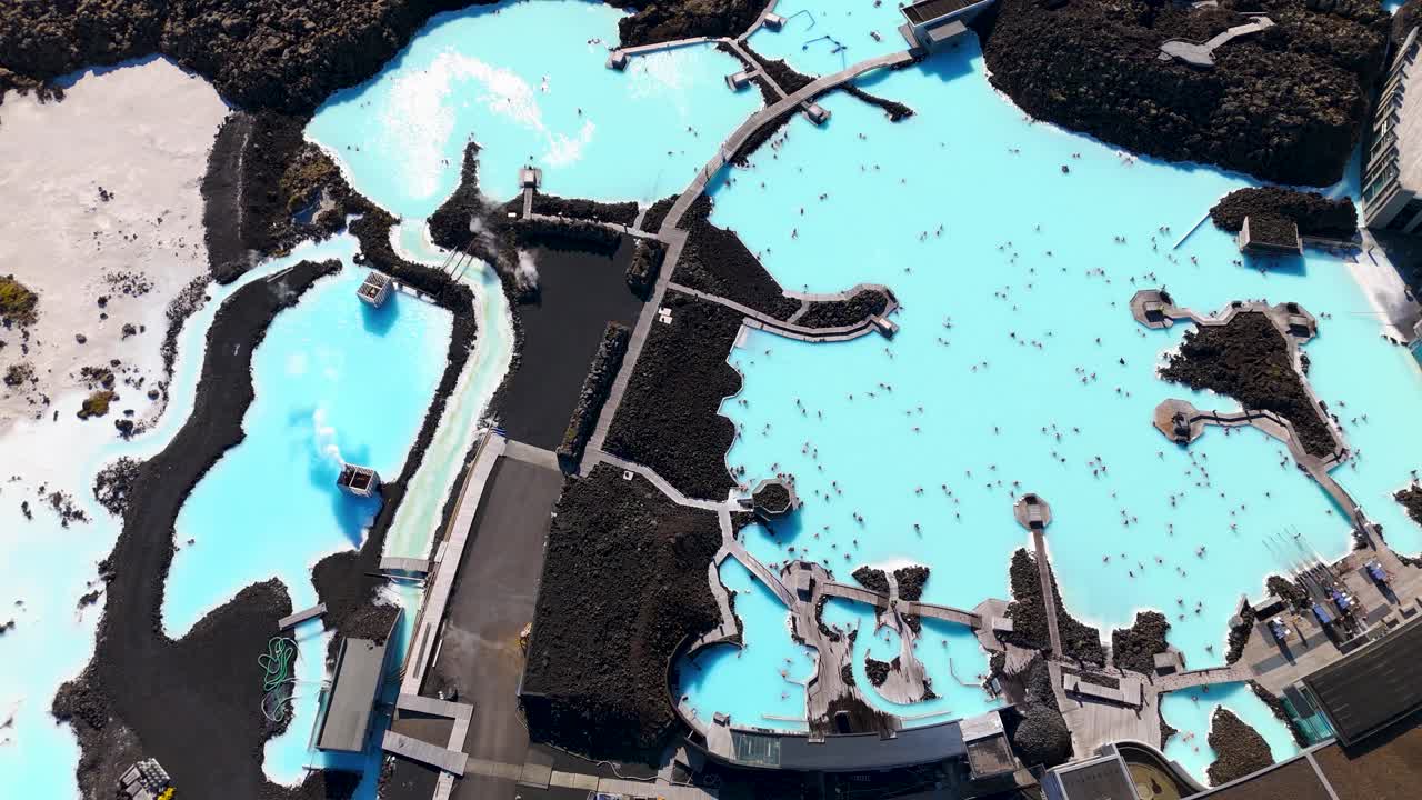 Top-down shot of tourists relaxing in the Blue Lagoon Thermal spa in Reykjavik