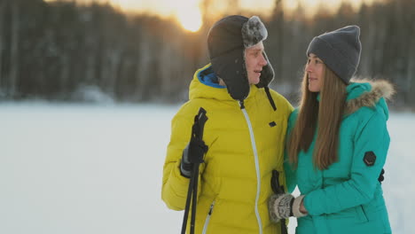 family skiers spend the weekend together doing skiing in the woods. healthy lifestyle. slow motion. loving couple