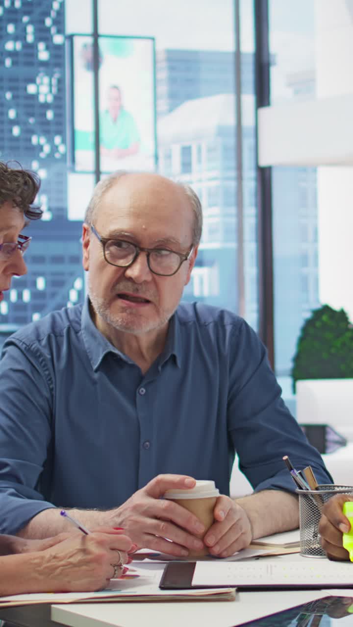 Vertical Video Senior people consulting with their financial banker about retirement plans