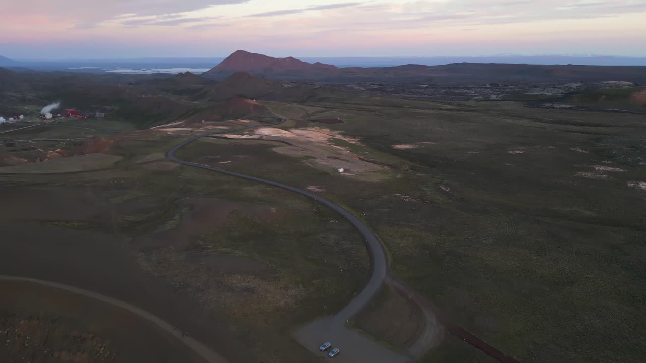 Aerial tilt up over Viti crater to Krafla volcanic slopes, Iceland