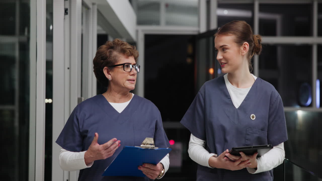 Two nurses in conversation