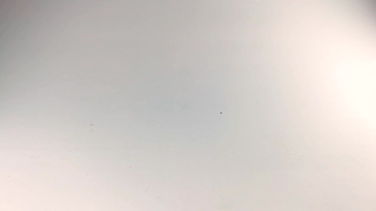 Male hand moving stacks of poker chips across the white table, ISOLATED, SLOMO, STILL