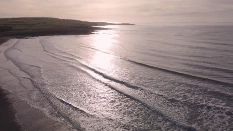 Slow-motion-of-winter-ocean-with-hazed-sunshine-and-moving-waves