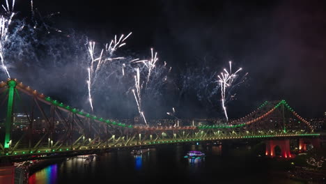bright colorful fireworks shooting off story bridge for brisbane riverfire festival, 4k