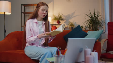 child girl student study at home on laptop computer making conference video call talking to webcam