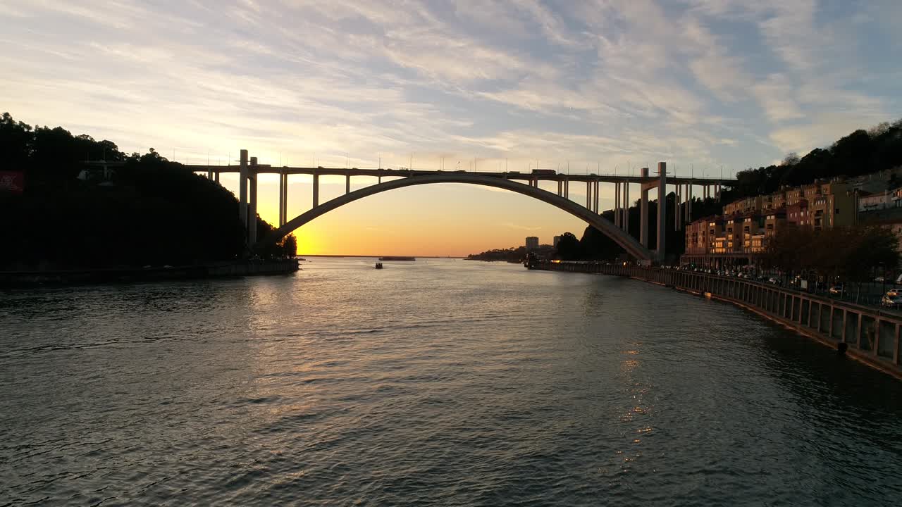 Porto City Arr&aacute;bida Bridge and River Douro at Sunset Aerial View