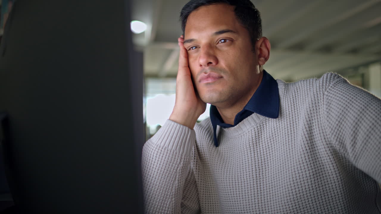 Tired businessman on computer remove glasses
