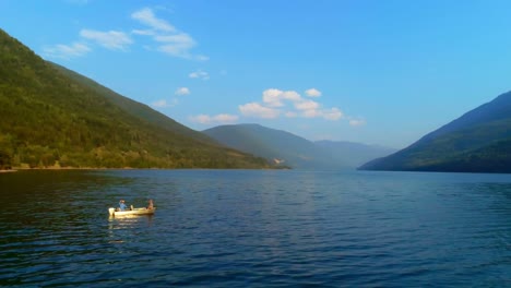 Tourists-fishing-on-a-boat-in-river-4k