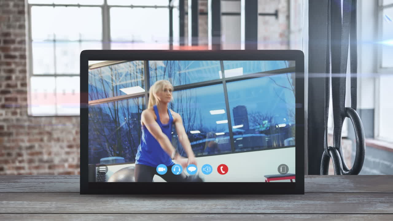 Animation of tablet computer showing a Caucasian woman exercising. Coronavirus  spreading