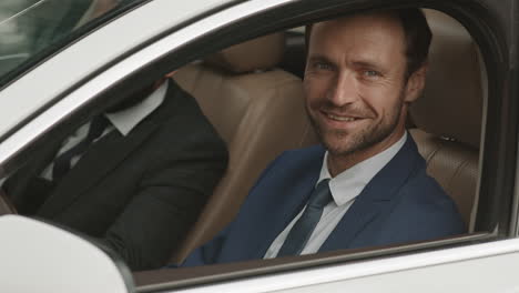 automobile driver posing in behind wheel