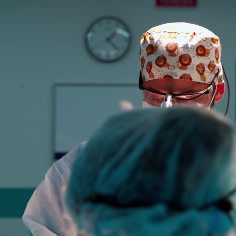 professional surgeon and assistant in modern hospital. surgical team in medical uniform are performing cosmetic surgery in the operating room.
