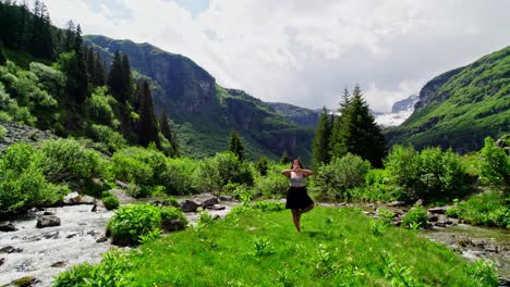 woman doing yoga tree pose in gorgeous swiss alps nature landscape