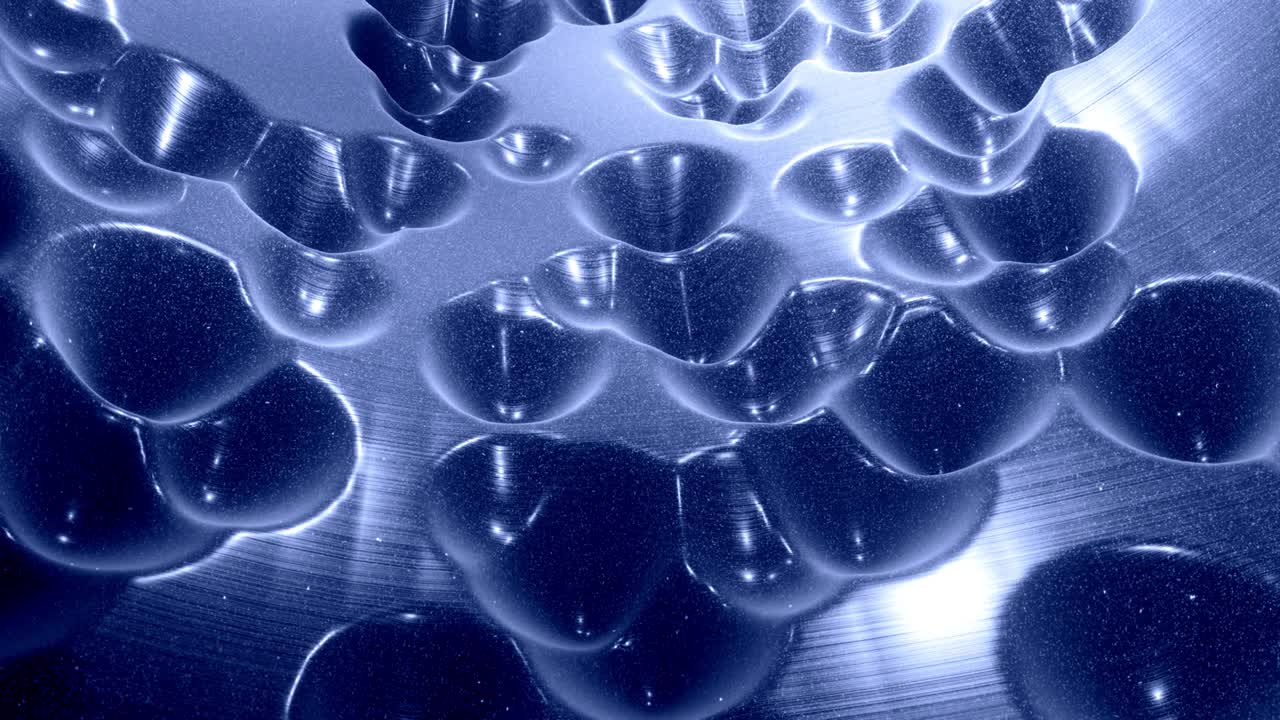 Stylish festive black bg. Fantastical abstract looped background, waves move on glossy surface like landscape made of liquid blue wax with sparkles. Beautiful soft background with smooth animation 4k