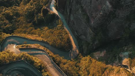 Top-down-aerial-view-of-one-of-the-most-beautiful-and-dangerous-roads-in-the-world-at-sunrise,-Serra-Do-Corvo-Branco,-Urubici,-Santa-Catarina,-Brazil