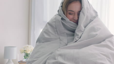 beautiful-woman-playing-in-bed-hiding-under-blanket-having-fun-enjoying-playful-morning-at-home