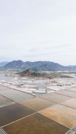 aerial vertical shot reverse dolly of the mountains in phan rang–tháp chàm.