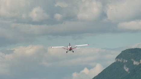 light aircraft over rugged mountainous terrain